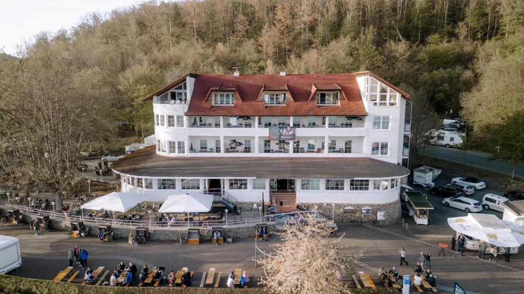 an overhead view of a building with a crowd of people at Terrassenhotel Seepromenade in Edersee