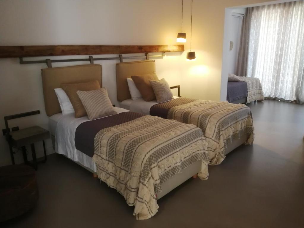 A bed or beds in a room at Evia Silence