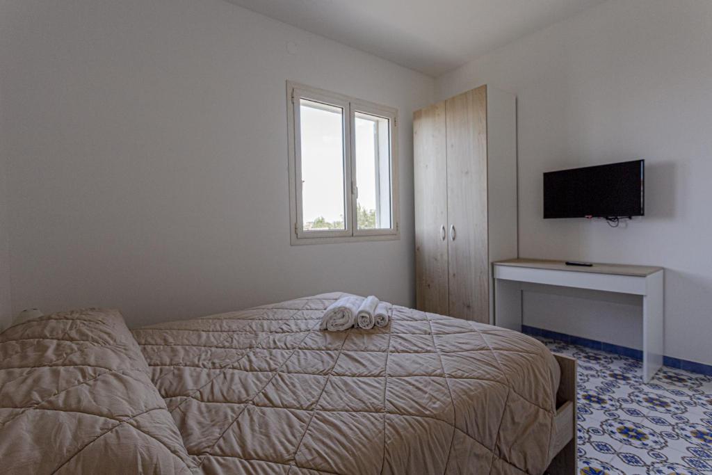 Postel nebo postele na pokoji v ubytování Milocca Homes