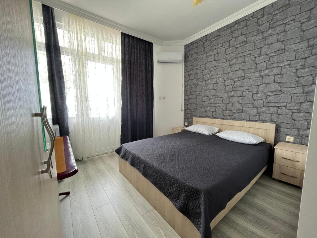 Postel nebo postele na pokoji v ubytování Zuri Kvariati