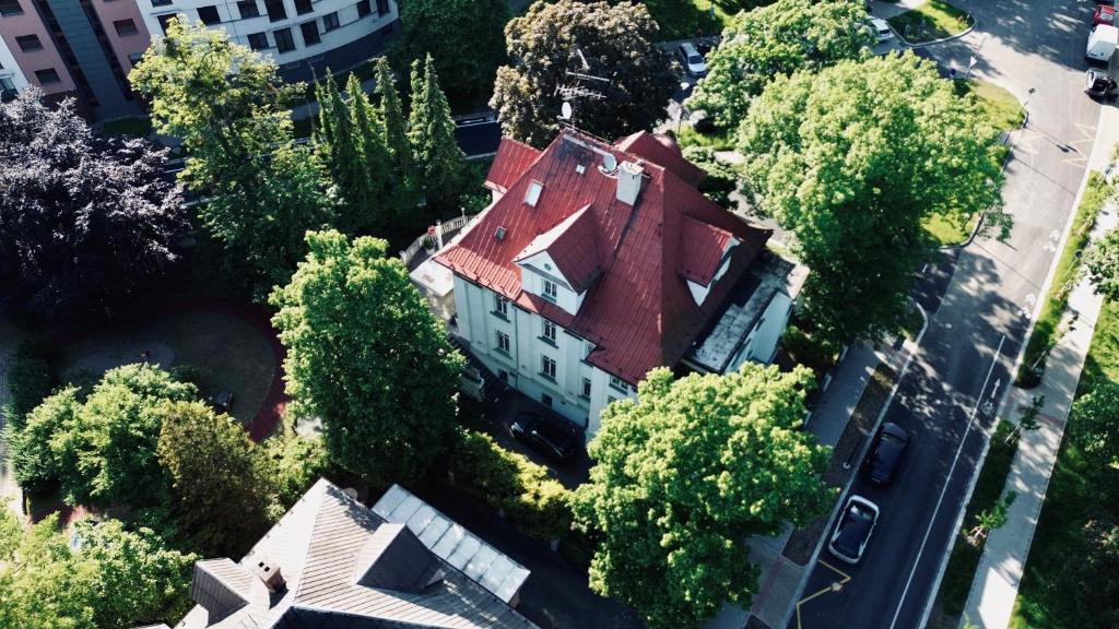 an overhead view of a house with a red roof at Retro Hotel Villa Ostrava in Ostrava