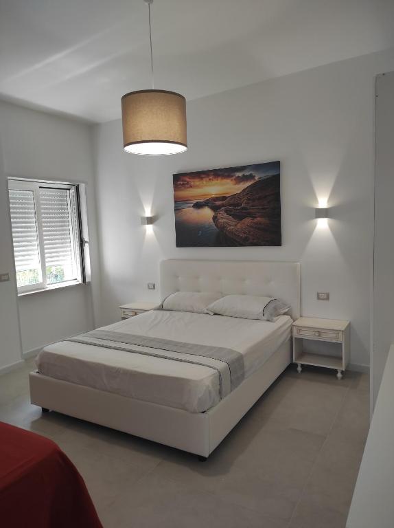 Postel nebo postele na pokoji v ubytování Deluxe Family Suite