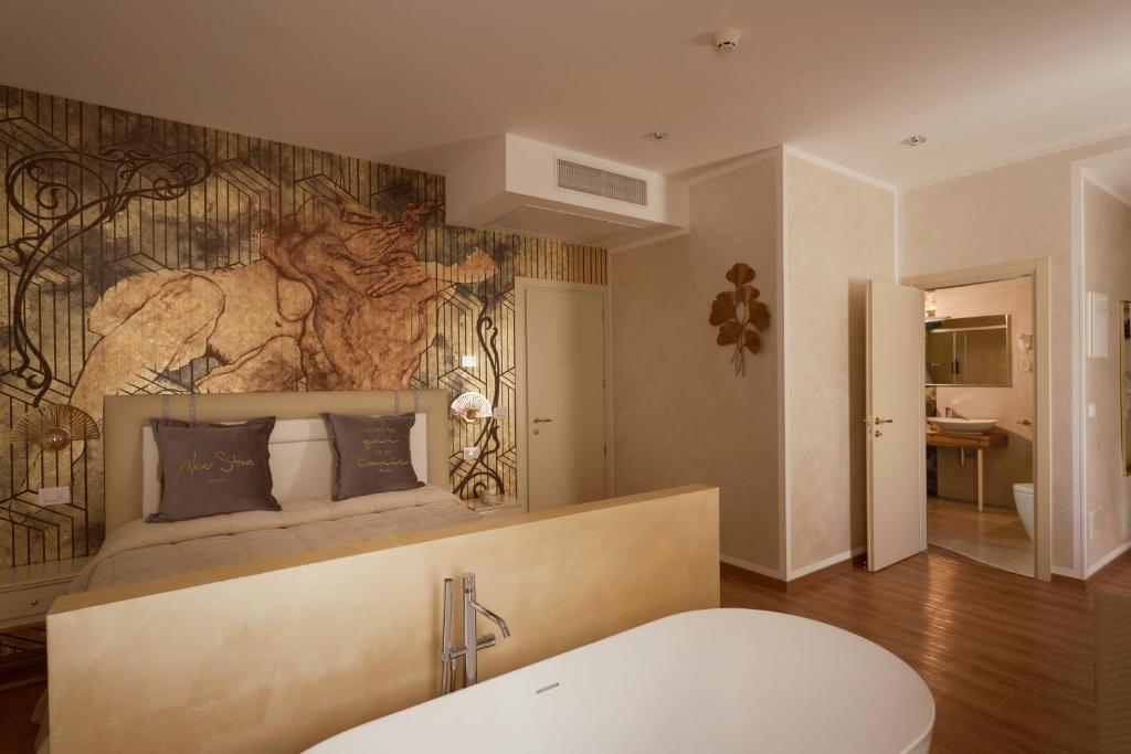 Postel nebo postele na pokoji v ubytování Amsterdam Suite Hotel & SPA