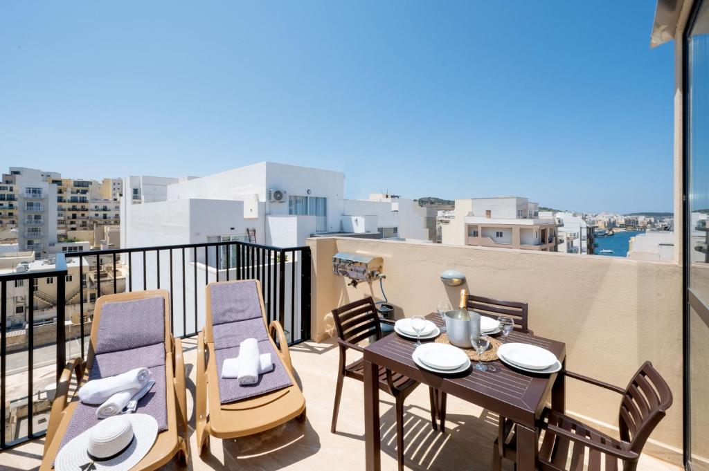 A restaurant or other place to eat at Sea Bliss penthouse with 2 terraces enjoying side Sea views by Getawaysmalta