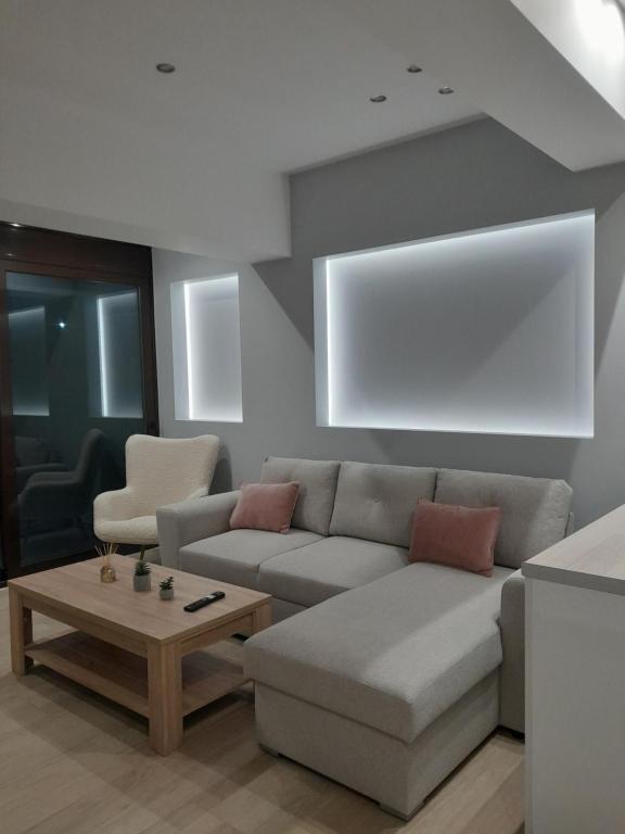a living room with a couch and a coffee table at Central House 2 in Ancient Epidauros