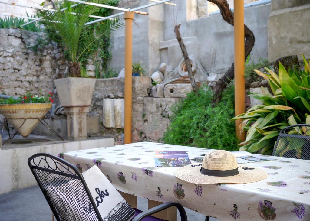 a hat sitting on a table on a patio at Central Eden - ZF Hvar in Hvar