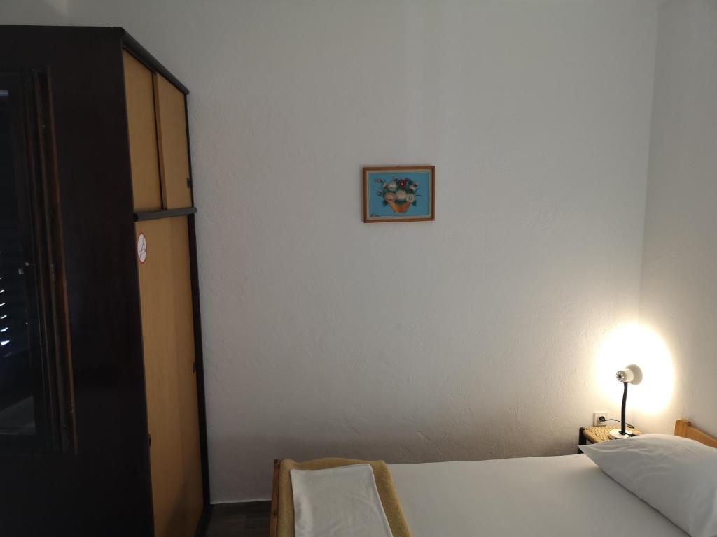 Postel nebo postele na pokoji v ubytování Apartments MINT Povljana - 50m from sandy beach