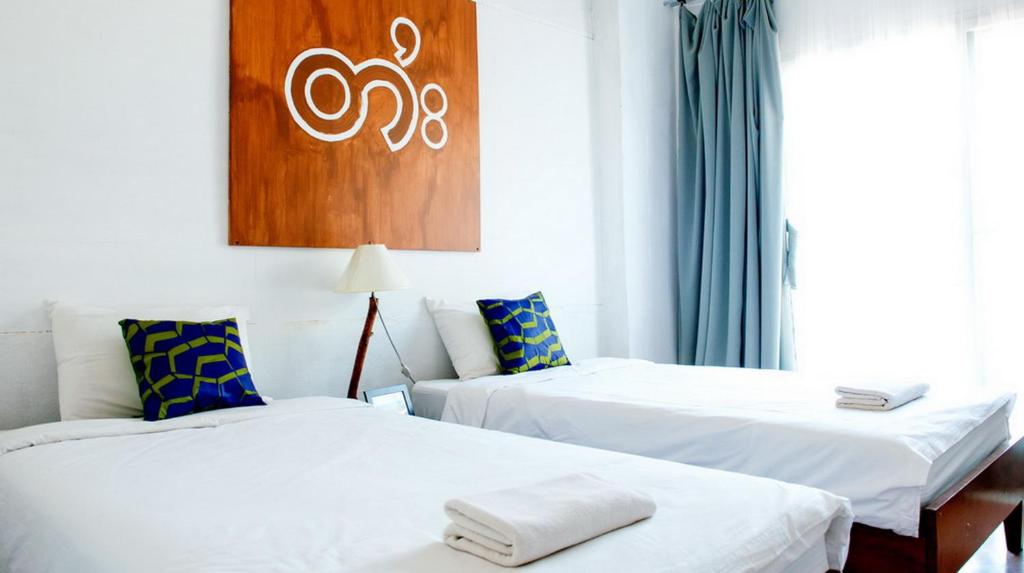 Postel nebo postele na pokoji v ubytování Yoont Hotel