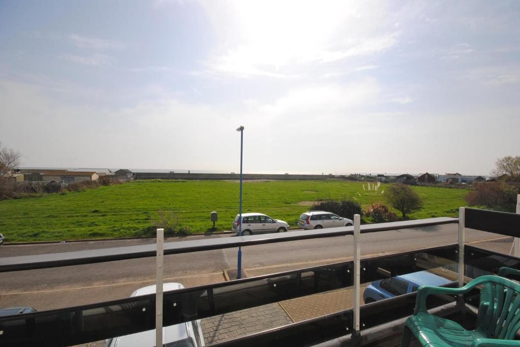 a view of a highway with cars on the road at Lifeboat View, Selsey in Selsey