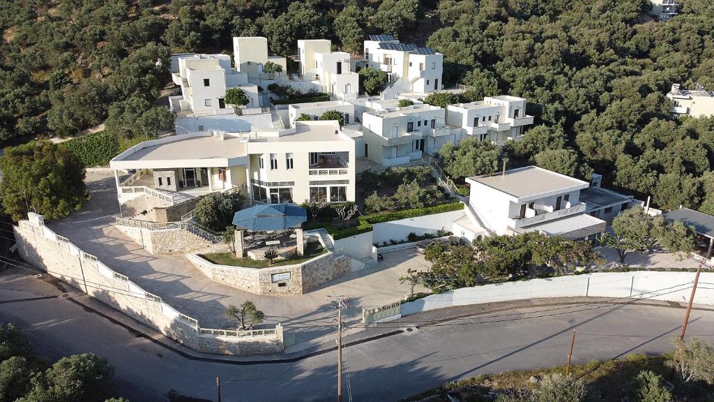an aerial view of a large white house at Polyrizos Hotel in Rodakino
