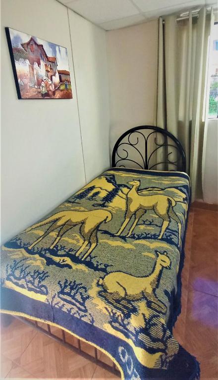 Letto o letti in una camera di Carlos Guest House 2 Cusco