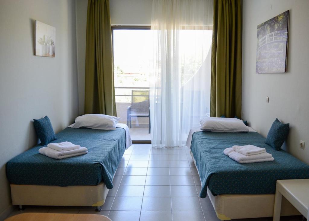 Voodi või voodid majutusasutuse IVORY HOTEL toas