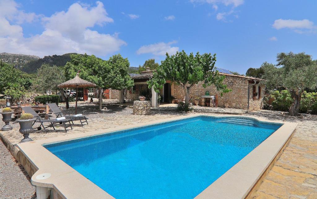 een zwembad voor een huis bij Finca Caselles de Baix 102 by Mallorca Charme in Pollença