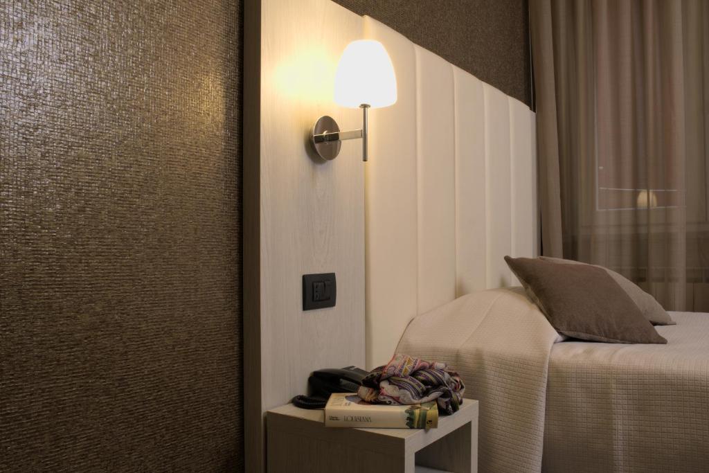 Postel nebo postele na pokoji v ubytování Hotel Stella Del Mare