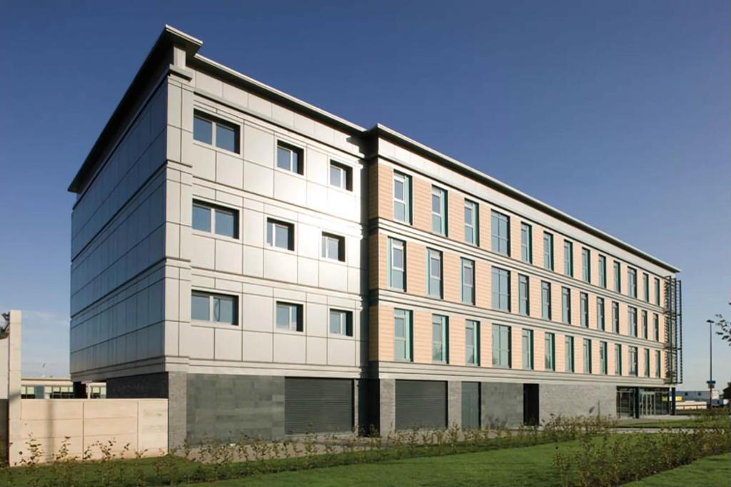 a large white building with a lot of windows at Edinburgh College Residence in Edinburgh