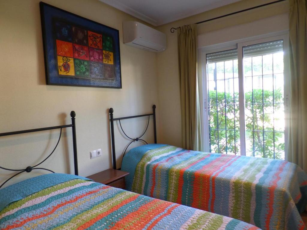 Postel nebo postele na pokoji v ubytování DUPLEX AL ANDALUS THALASSA