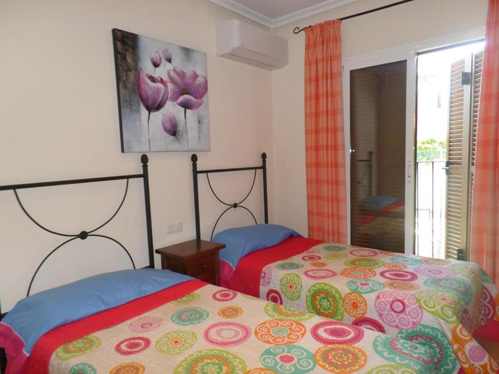 Postel nebo postele na pokoji v ubytování DUPLEX AL ANDALUS THALASSA