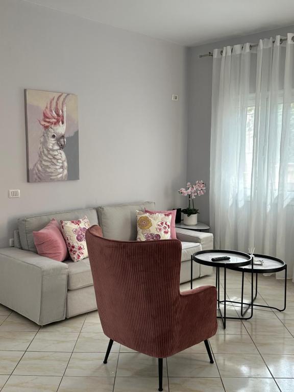 a living room with a couch and a table at Saranda Apartments in Sarandë