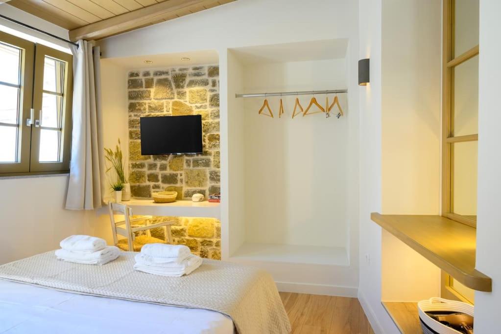 Postel nebo postele na pokoji v ubytování Manolis House