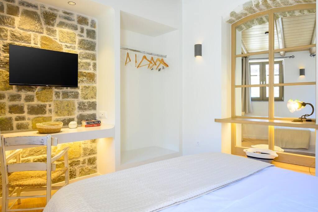 Postel nebo postele na pokoji v ubytování Manolis House