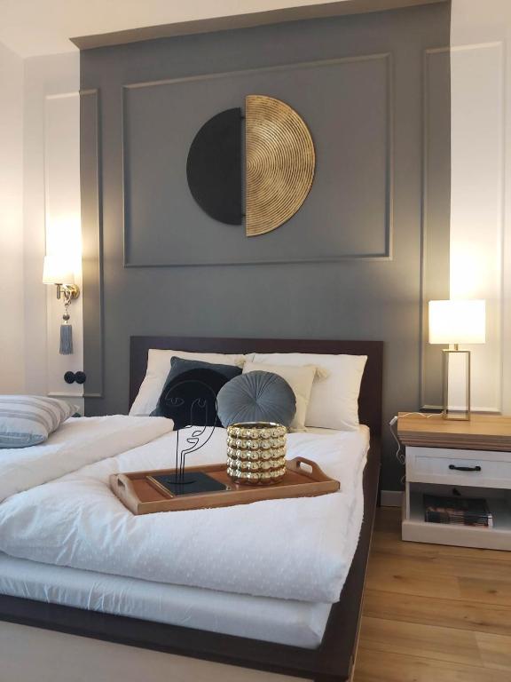 a bedroom with two beds with a tray on the bed at Bocianie Gniazdo in Chwalimki