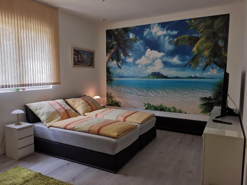 a bedroom with a large painting of a beach at Latic in Liezen