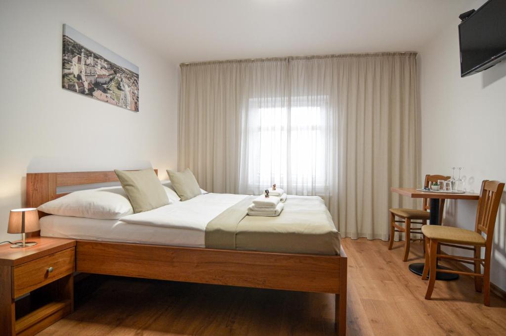 Łóżko lub łóżka w pokoju w obiekcie Residence Malva