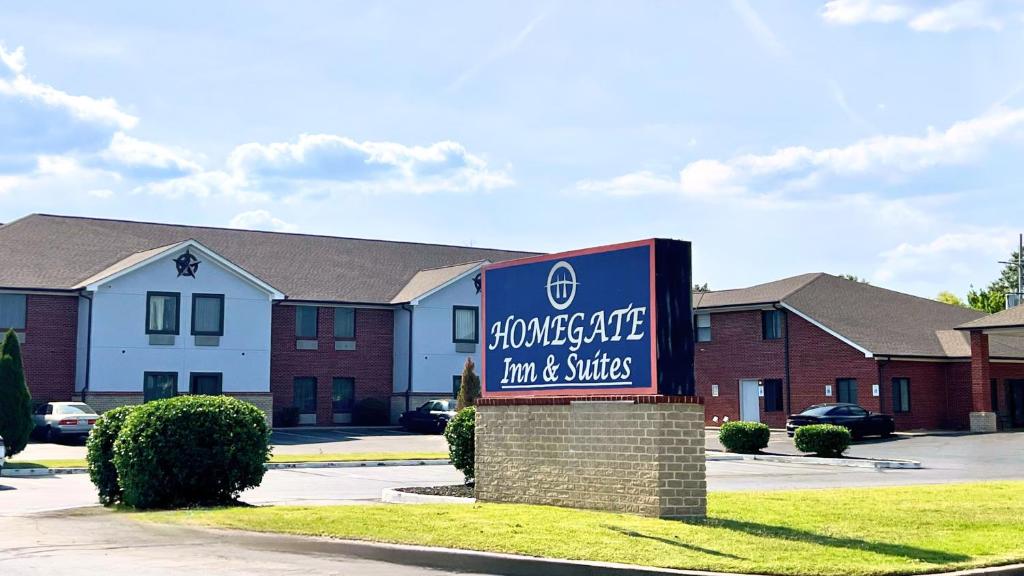 a sign for a glucose safe inn and suites at Home Gate Inn & Suites in Southaven