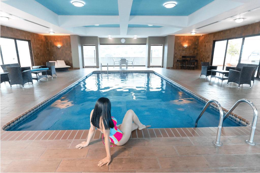 Bazén v ubytování Hotel Plaza Juan Carlos nebo v jeho okolí