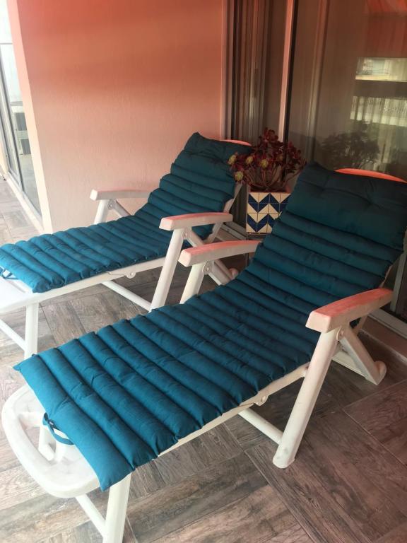 two beach chairs with blue cushions on a porch at ANTIBES très belle situation ! in Antibes