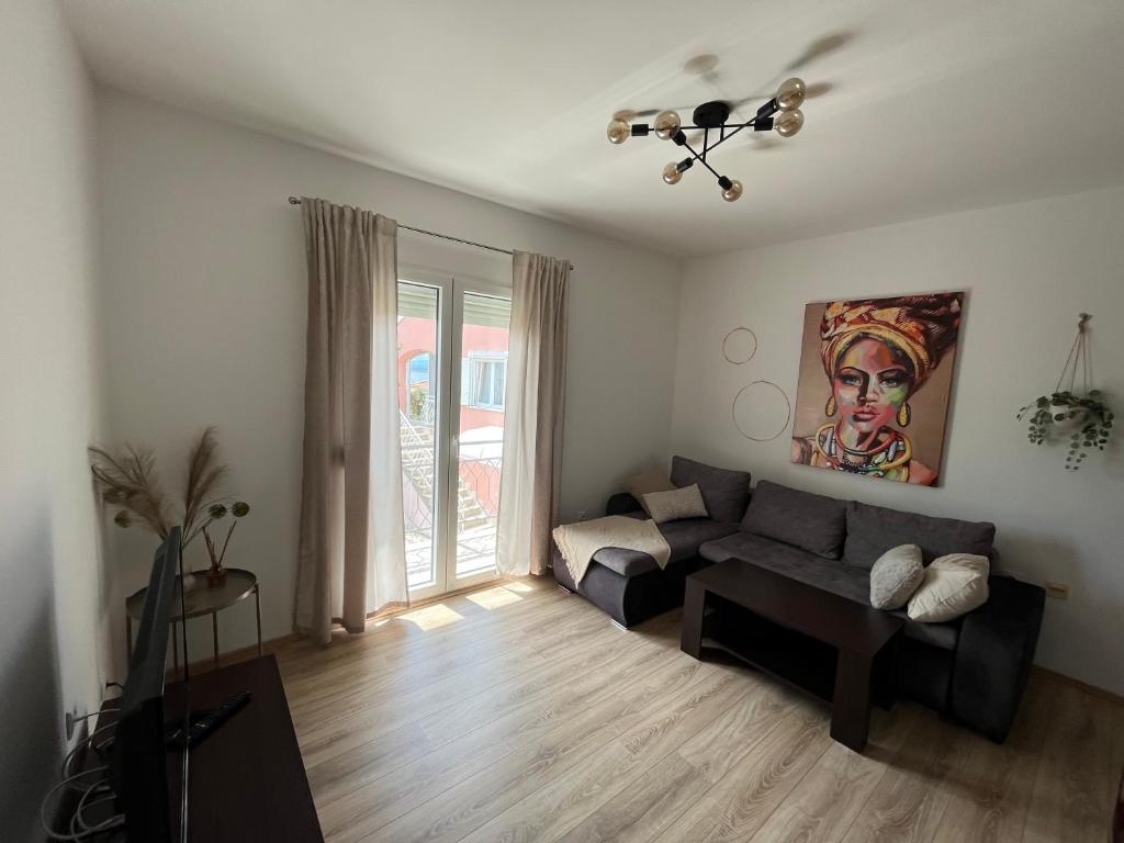 a living room with a couch and a table at Villa Marija in Crikvenica