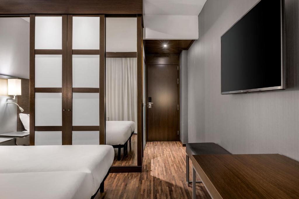 Postel nebo postele na pokoji v ubytování AC Hotel by Marriott Pisa