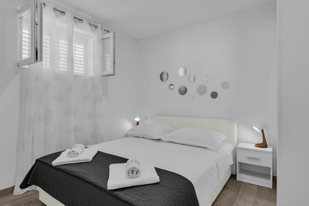 Posteľ alebo postele v izbe v ubytovaní Sunny Garden Apartments Ana