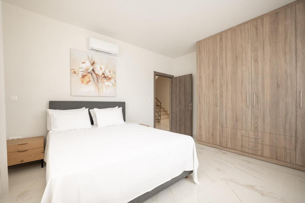 Postel nebo postele na pokoji v ubytování Kalisun Exclusive Villas