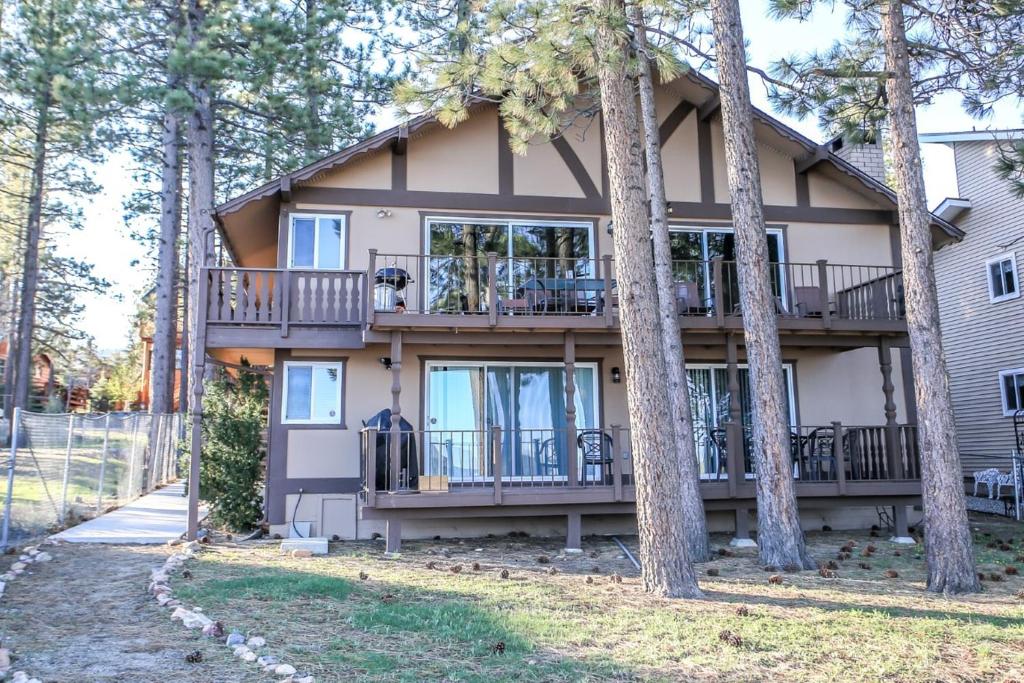 a large house with trees in front of it at Lakefront Cottage - Trip Advisor Certificate of Excellence winner with gorgeous lake views! in Big Bear Lake