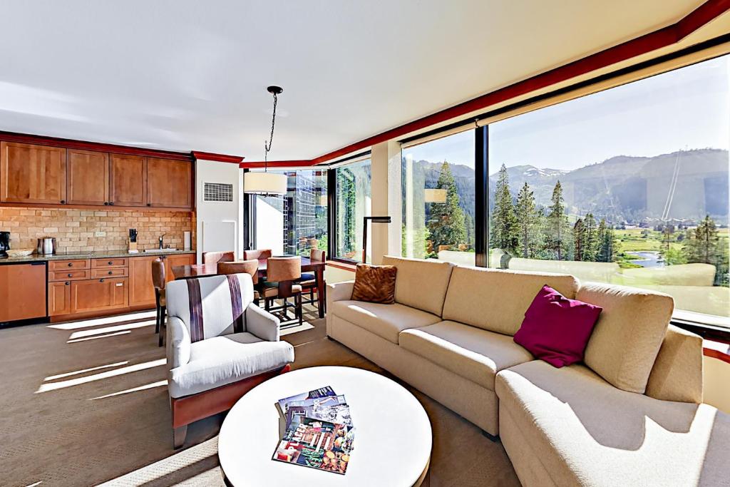 a living room with a couch and a table at Resort at Squaw Creek's 556, 558, & 560 in Olympic Valley