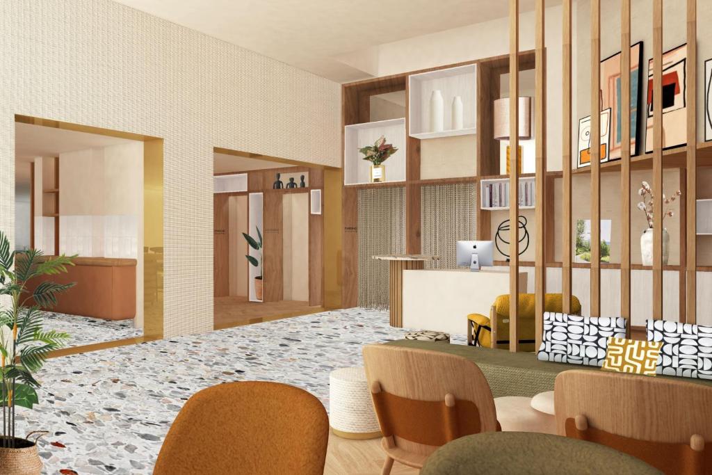 a rendering of a lobby with a table and chairs at Residence Inn by Marriott Paris Didot Montparnasse in Paris