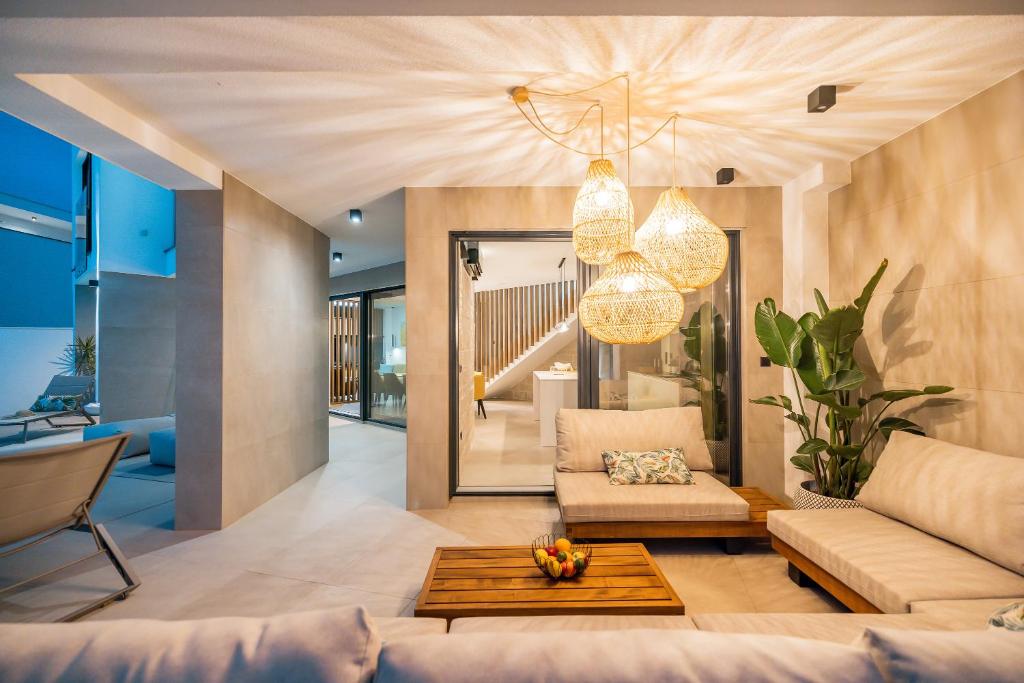a living room with a couch and a table at Villa Corus in Murter