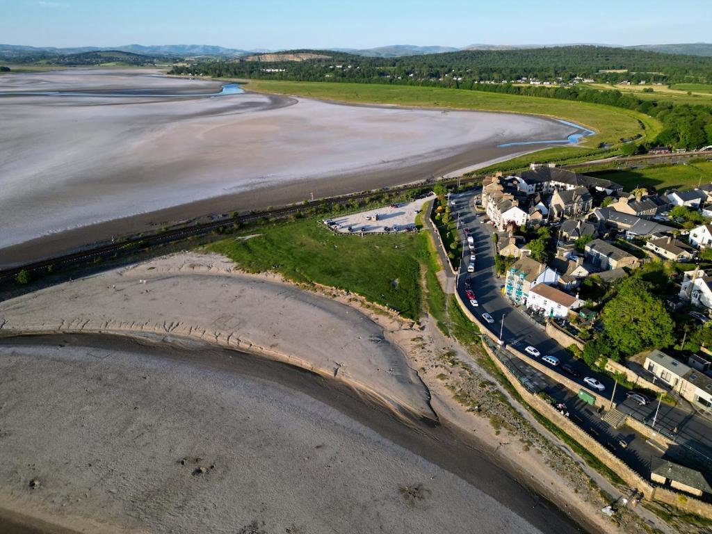 an aerial view of the beach and the ocean at Ye Olde Fighting Cocks in Arnside