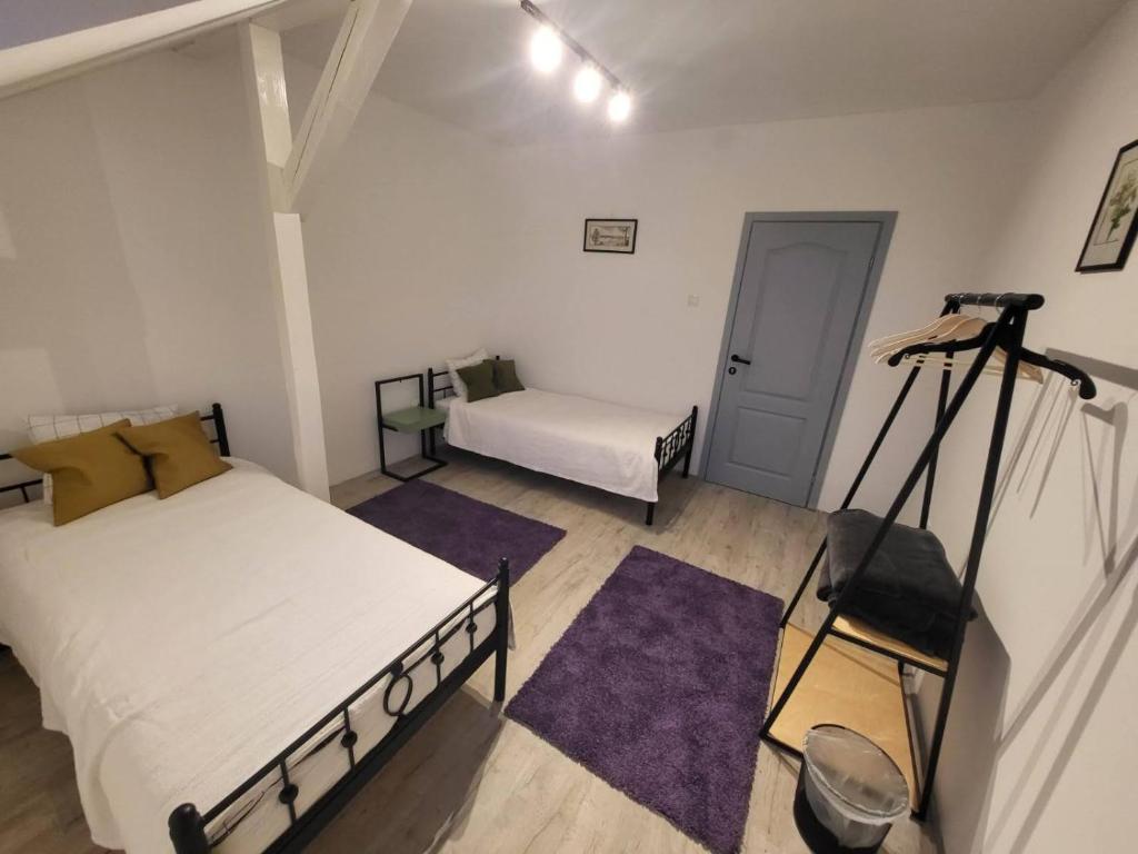 Postel nebo postele na pokoji v ubytování Villa Artisan