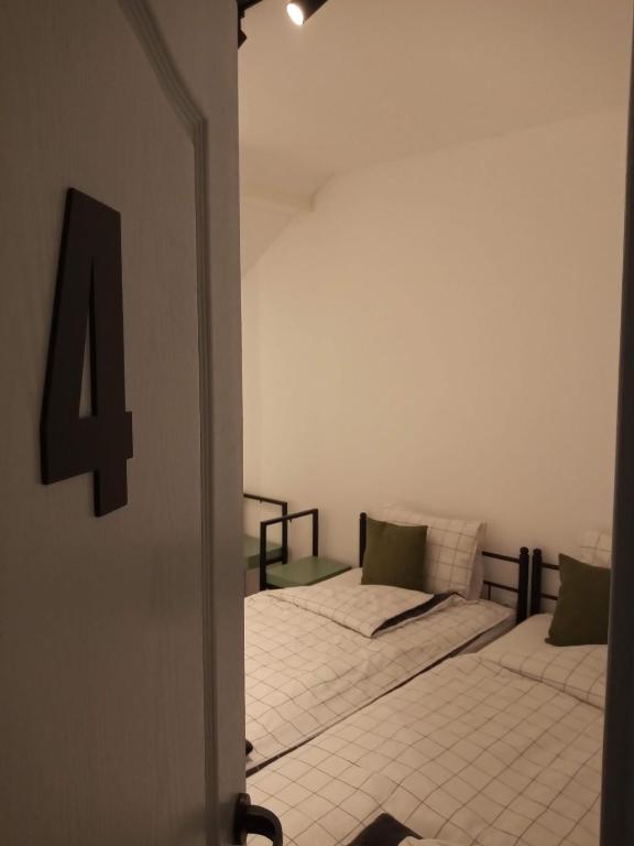 Postel nebo postele na pokoji v ubytování Villa Artisan