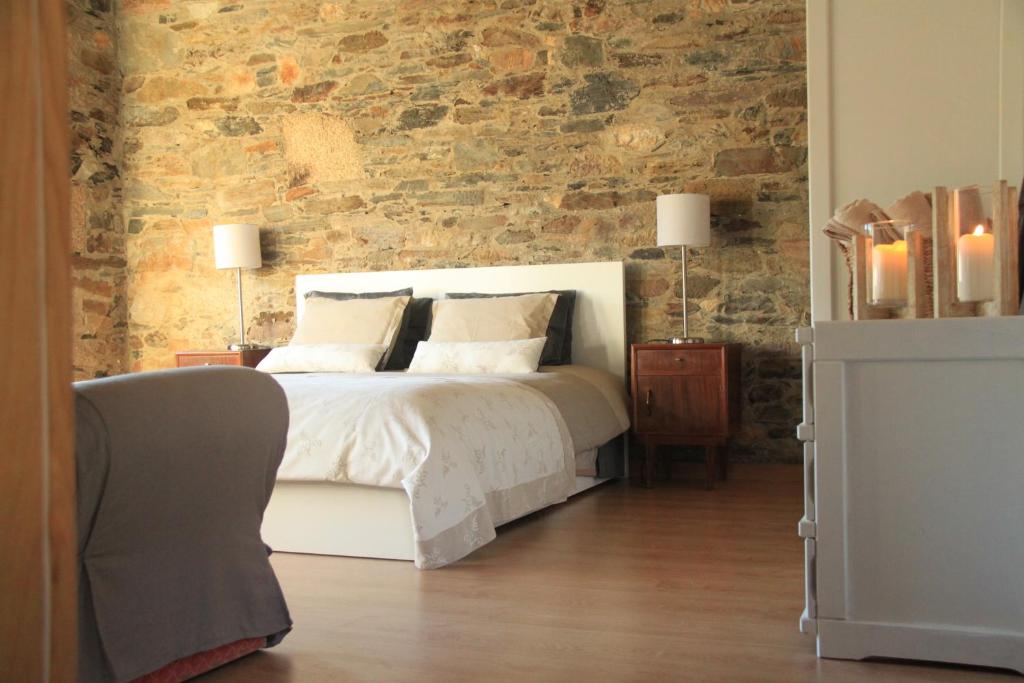 Ένα ή περισσότερα κρεβάτια σε δωμάτιο στο Casa do Páteo