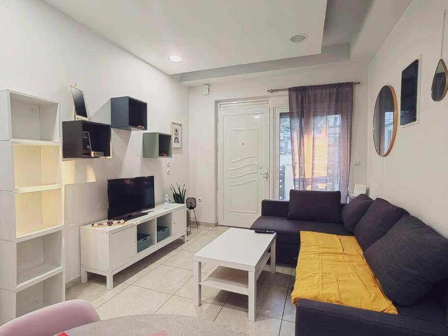 a living room with a couch and a table at The Cozy Nest in Rhodes town in Rhodes Town