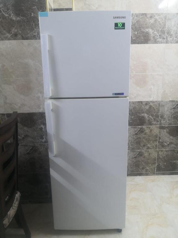 Kuchyň nebo kuchyňský kout v ubytování White tulips apartment الزنبقة البيضاء