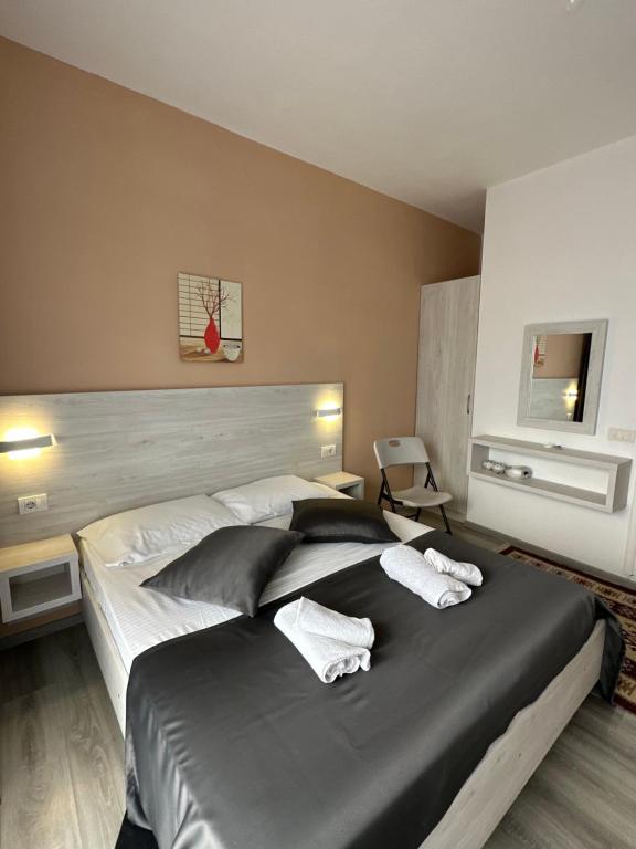 Postel nebo postele na pokoji v ubytování Molla Apartments