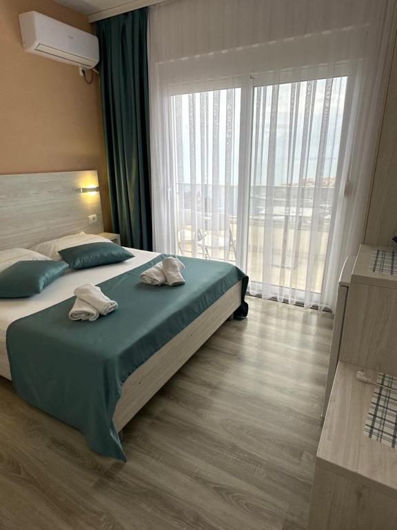 Postel nebo postele na pokoji v ubytování Molla Apartments