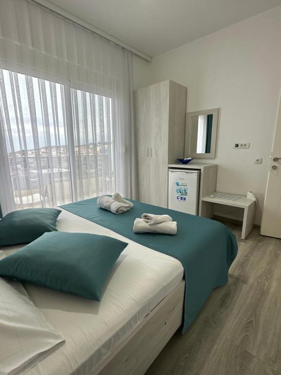 Postel nebo postele na pokoji v ubytování Molla Apartments
