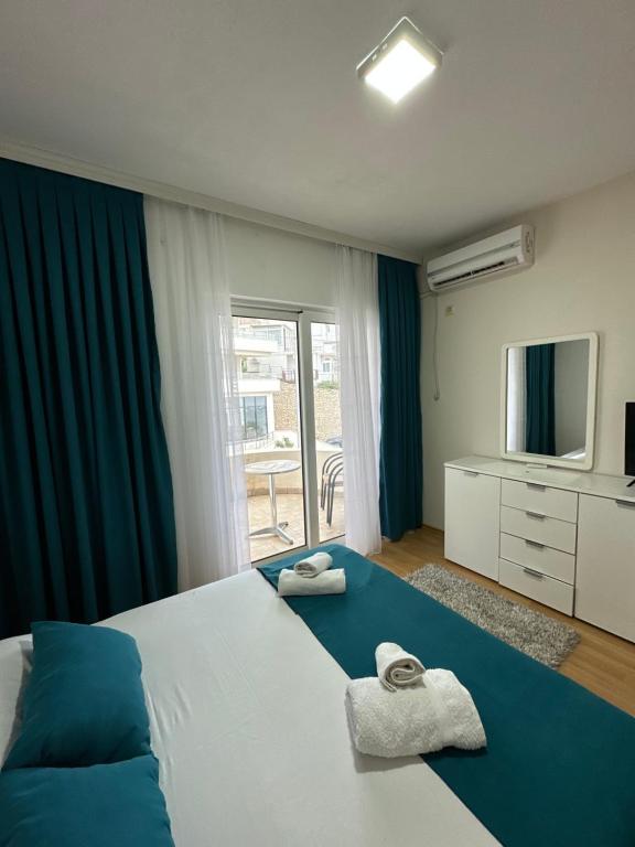 Postel nebo postele na pokoji v ubytování Molla Apartments