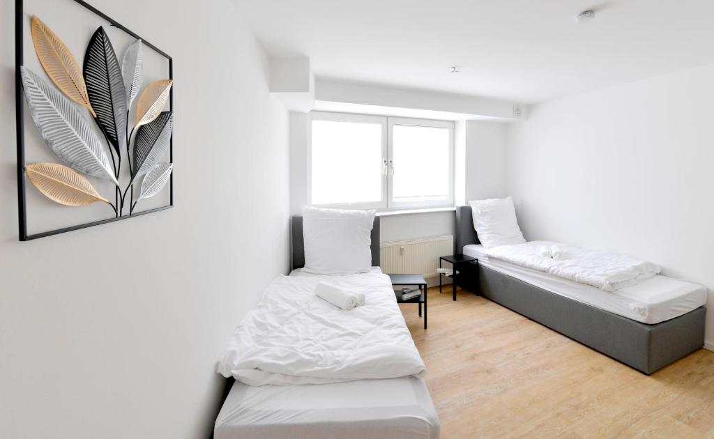Postel nebo postele na pokoji v ubytování Stay and Work Apartment - 8 beds - 4 bed rooms
