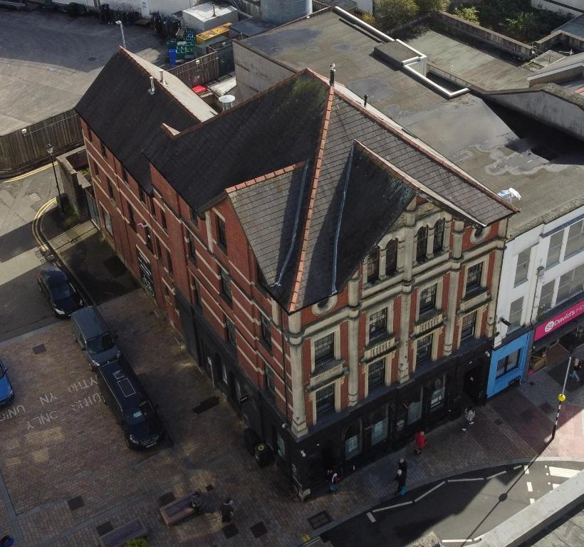 an overhead view of a large brick building at Captivating 1-Bed apartment Merthyr Tydfil - in Merthyr Tydfil
